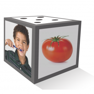 A Big Cube showing three sides with cards added to each side. Side 1 shows five dots. Side 2 shows a child brushing their teeth. Side 3 shows a tomato.