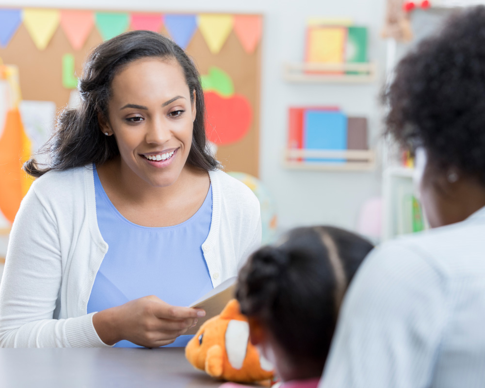 teacher speaking with parent