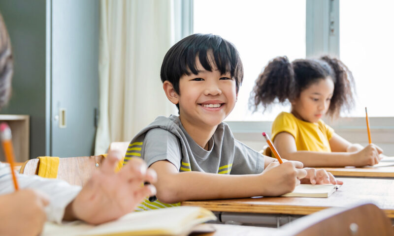 Child writing at desk