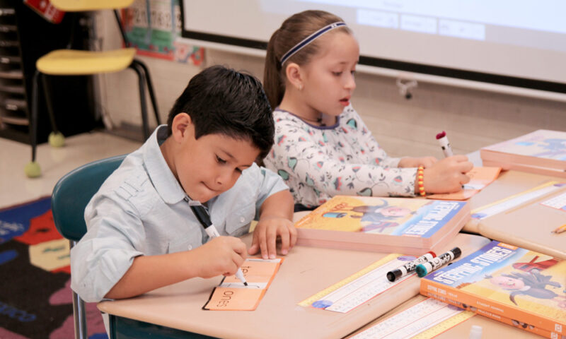 2 children at desk