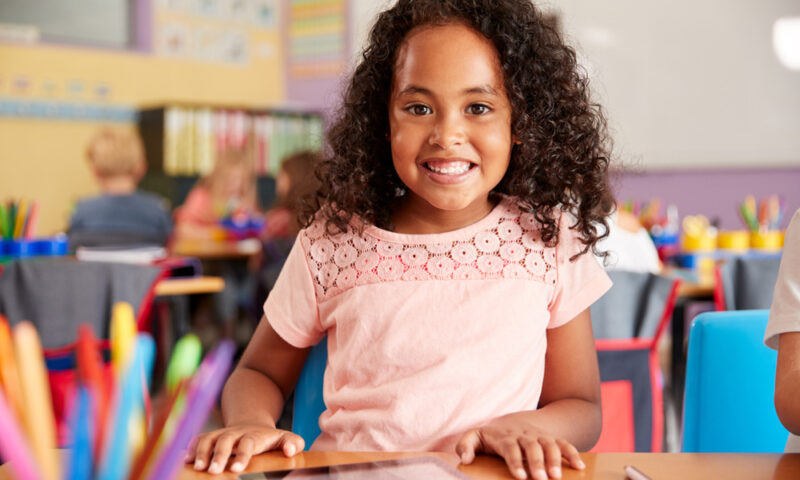 student smiling in classroom